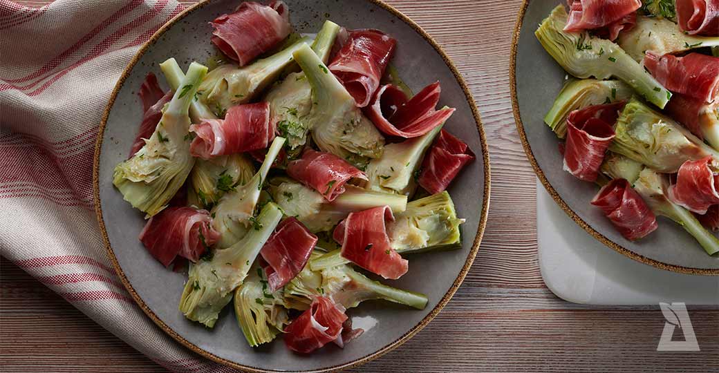 Alcachofas confitadas con jamón Ibérico